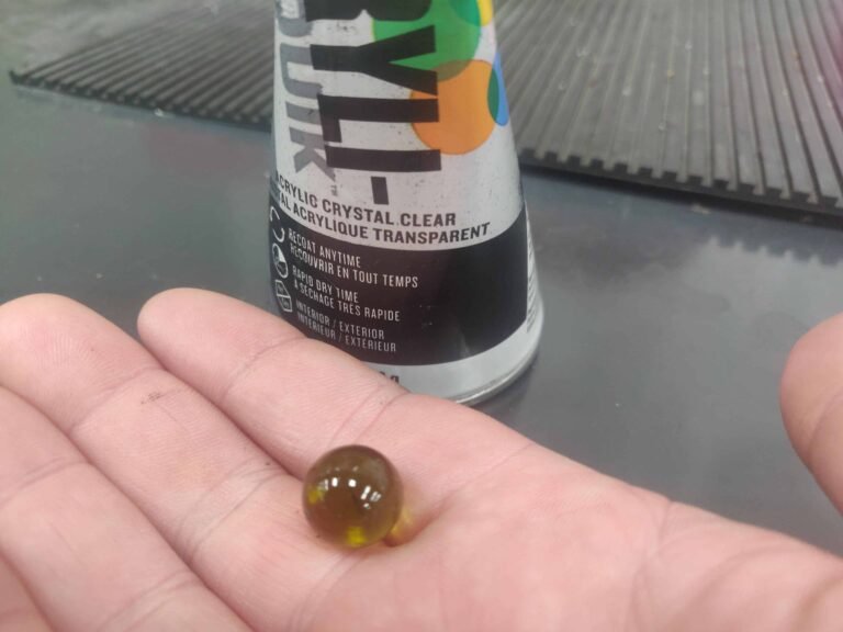 why is there a ball inside a spray can